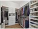 Well-organized walk-in closet with clothing racks, shelves for shoes, and built-in drawers at 807 W Kentucky Ave, Tampa, FL 33603