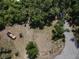 Aerial view of a vacant lot amidst lush trees on a sunny day at 8601 N 28Th St, Tampa, FL 33604
