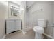 Bathroom featuring a vanity, framed mirror, and updated toilet at 8805 Plum Grove Ct, Tampa, FL 33634