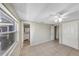 Spacious bedroom with tile flooring leading to en suite bathroom, walk-in closet, and backyard view at 8805 Plum Grove Ct, Tampa, FL 33634