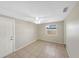 Bright bedroom with tile flooring, ceiling fan, and natural light from the window at 8805 Plum Grove Ct, Tampa, FL 33634