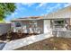 The house has a walkway leading to a white door and well-maintained landscaping at 8805 Plum Grove Ct, Tampa, FL 33634