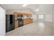 Kitchen has a full suite of black appliances and a large pantry at 8805 Plum Grove Ct, Tampa, FL 33634