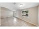 Bright, open floor plan features tile flooring and large windows at 8805 Plum Grove Ct, Tampa, FL 33634