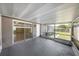 Screened patio with sliding glass doors and a view to the backyard at 8805 Plum Grove Ct, Tampa, FL 33634