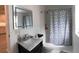 Contemporary bathroom with marble vanity, tile shower, and modern fixtures at 945 8Th N St, St Petersburg, FL 33712