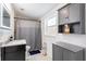 Modern bathroom with marble vanity, hexagon tile, and gray accents at 945 8Th N St, St Petersburg, FL 33712
