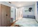 Comfortable bedroom with a closet, decorative touches, and natural light at 945 8Th N St, St Petersburg, FL 33712