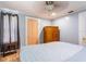 Serene bedroom with a cozy bed, classic ceiling fan, ample closet space, and a calming color scheme, promoting restful nights at 945 8Th N St, St Petersburg, FL 33712