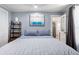 Comfortable bedroom with a large bed, blue walls, and decorative artwork at 945 8Th N St, St Petersburg, FL 33712