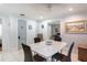 Bright dining room features a white table, seating for four, and easy access to the living room and other areas at 945 8Th N St, St Petersburg, FL 33712