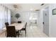Open dining area with tile floors and seamless connection to the bright kitchen at 945 8Th N St, St Petersburg, FL 33712