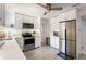 Modern kitchen with stainless steel appliances, white cabinetry, and modern hardware at 945 8Th N St, St Petersburg, FL 33712