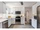 Bright kitchen featuring white cabinets, stainless steel appliances, and modern finishes at 945 8Th N St, St Petersburg, FL 33712