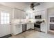 Well-lit kitchen with stainless steel appliances, ample counter space, and abundant storage at 945 8Th N St, St Petersburg, FL 33712