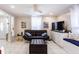 Well-lit living room featuring a sectional sofa, entertainment center, and integrated window seating, perfect for modern living at 945 8Th N St, St Petersburg, FL 33712
