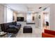 Cozy living room featuring a modern sectional sofa, entertainment center, and integrated window seating with plenty of room at 945 8Th N St, St Petersburg, FL 33712
