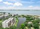 A waterfront community offers stunning views, a pool, and lush landscaping at 100 Oakmont Ln # 310, Belleair, FL 33756