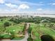 Gorgeous aerial view showcasing a golf course and a waterfront condo community at 100 Oakmont Ln # 310, Belleair, FL 33756