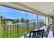 Chairs on a balcony offering scenic water view with lush greenery, trees, and the city skyline at 100 Oakmont Ln # 310, Belleair, FL 33756