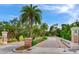 Belleair Country Club and Belleview Inn entrance with brick columns and lush landscaping at 100 Oakmont Ln # 310, Belleair, FL 33756