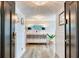 Inviting hallway featuring wood-look flooring, stylish decor, and elegant lighting fixtures at 100 Oakmont Ln # 310, Belleair, FL 33756
