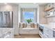 Charming kitchen nook features a comfortable window seat, custom cabinets, and scenic water views at 100 Oakmont Ln # 310, Belleair, FL 33756
