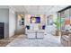 Bright and cozy living room featuring custom wall decor and cabinets, and modern furnishings at 100 Oakmont Ln # 310, Belleair, FL 33756