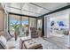 Inviting living space with water view, comfortable seating, and access to a private balcony at 100 Oakmont Ln # 310, Belleair, FL 33756