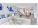 Open living and dining area with a modern kitchen, with stylish decor and lots of light at 100 Oakmont Ln # 310, Belleair, FL 33756