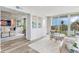 Open and inviting living room with water views and balcony access at 100 Oakmont Ln # 310, Belleair, FL 33756