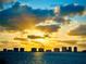 Beautiful sunset view featuring a dramatic skyline over the water, creating a tranquil and breathtaking scene at 100 Oakmont Ln # 310, Belleair, FL 33756
