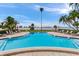 A pristine community swimming pool overlooks the waterfront at 100 Oakmont Ln # 310, Belleair, FL 33756