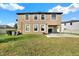 Large backyard with lush green grass and a concrete patio at 10106 Count Fleet Dr, Ruskin, FL 33575