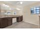 Bathroom with double vanity, granite countertops, and tile floors at 10106 Count Fleet Dr, Ruskin, FL 33575