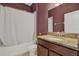 Well-maintained bathroom featuring a shower and tub combination and a granite vanity at 10106 Count Fleet Dr, Ruskin, FL 33575
