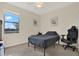Bright bedroom featuring tile floors, a window with a view, and ample space at 10106 Count Fleet Dr, Ruskin, FL 33575