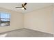 Comfortable bedroom featuring plush carpet and a ceiling fan at 10106 Count Fleet Dr, Ruskin, FL 33575