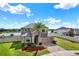 Exterior view of a well-maintained home with a lush green lawn at 10106 Count Fleet Dr, Ruskin, FL 33575