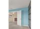 Inviting hallway featuring modern accents and open doorway at 10106 Count Fleet Dr, Ruskin, FL 33575