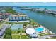 Scenic aerial view highlighting the condo community's waterfront location, pool, and tennis at 10216 Regal Dr # 208, Largo, FL 33774