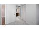 Modern bathroom with a full mirror view of a bathroom, a walk-in closet, and a wood door at 10216 Regal Dr # 208, Largo, FL 33774