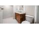 Chic bathroom with marble countertop vanity, toilet, and frameless shower, perfect for modern living at 10216 Regal Dr # 208, Largo, FL 33774