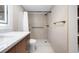 Contemporary bathroom featuring a marble-topped vanity, open shower, and stylish bronze fixtures at 10216 Regal Dr # 208, Largo, FL 33774