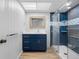 Bright bathroom features a glass shower and modern vanity at 10216 Regal Dr # 208, Largo, FL 33774