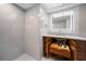 Updated bathroom boasts a sleek vanity with pull-out shelves and a spacious, frameless glass shower at 10216 Regal Dr # 208, Largo, FL 33774