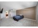 Bedroom featuring wood accent wall, neutral carpet, and adjacent bathroom and closet at 10216 Regal Dr # 208, Largo, FL 33774