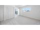 Bright bedroom with closet and balcony access at 10216 Regal Dr # 208, Largo, FL 33774