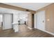 Open-concept kitchen with white cabinets, and a breakfast bar at 10216 Regal Dr # 208, Largo, FL 33774