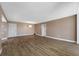 Spacious living room with hardwood floors and neutral paint, awaiting your personal touch at 10216 Regal Dr # 208, Largo, FL 33774